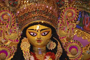 Category Historic EN Prints: Decorative Durga clay model showing third eye open on Durga puja