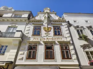 Decorative historic facade with eagle on a bright blue sky Old town Burgerhaus Zum goldenen Reichsadler Krems