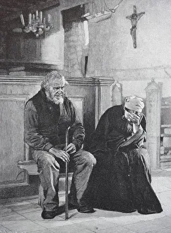 In deep mourning, two grieving old people in church