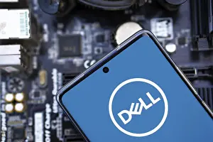 Category Historic EN Prints: Dell company logo displayed on mobile phone