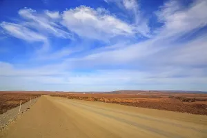 The Dempster Highway crossing the arctic tundra just north of the Yukon border