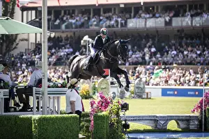 Denis Lynch of Ireland and riding Vistogrand compete in the first round of the 1