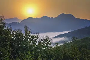 Dense clouds at the bottom of the valley in mountains of northern Laos