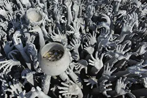 Depiction of hell, hands pleading for help and a begging bowl