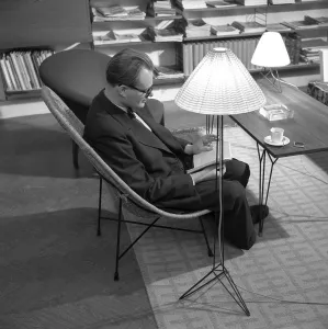The designers of the Swedish String shelf. Nisse Strinning (1917-2006) pictured at home 1952