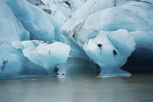 Detailed close-up of blue icebergs showcasing cracks and textures