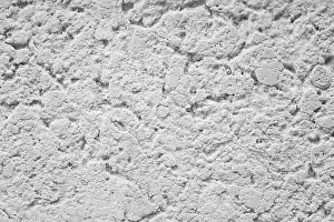 A detailed close-up image of a white concrete surface