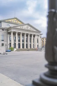 Detailed side view of a magnificent building with columns in Munich