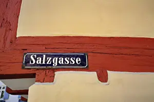 Detailed view of a road sign on a half-timbered house