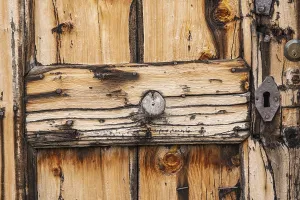 Detailed view of a rustic wooden door of a hut on the Glatsch Alm