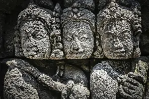 Details of sculptures and reliefs on the walls of the Borobudur temple in Java
