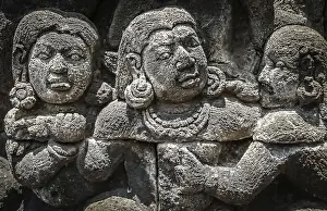Details of sculptures and reliefs on the walls of the Borobudur temple in Java