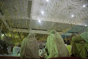 Devotees listening music in the hall