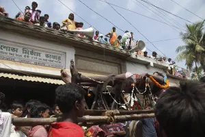 Devotees lying on bed made of blades