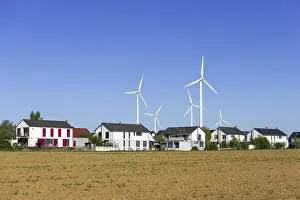 Digital Composing, new housing estate with wind turbines