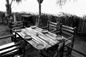 Dining rustic table and chairs for six in restaurant Mumbai Maharashtra India Asia 1982