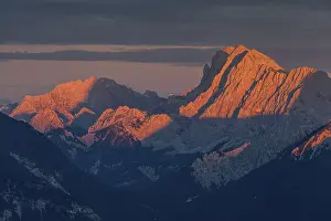 Distant view of steep mountains in the evening light