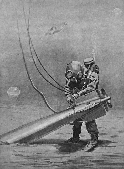 Diver tying up a torpedo stuck in the mud