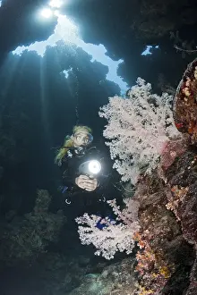 Diver in underwater cave, Zabargad, Red Sea, Egypt