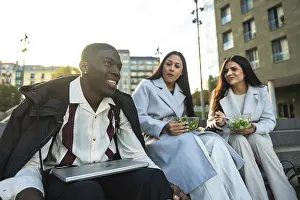 Diverse group of young adult colleagues or friends smiling