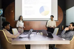 A diverse team engages in a modern office meeting
