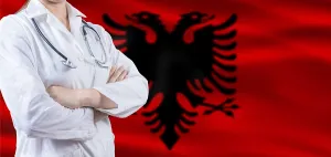 Doctor with crossed arms on Albania flag