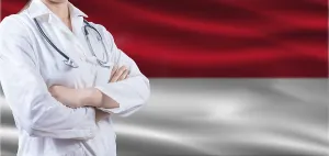 Doctor with crossed arms on Monaco flag