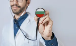 Doctor holding stethoscope with Bulgaria flag