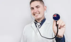 Doctor showing stethoscope with New Zealand flag