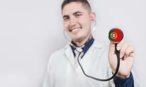 Doctor showing stethoscope with Portugal flag