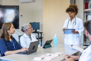 Doctors and nurses participating in a medical briefing
