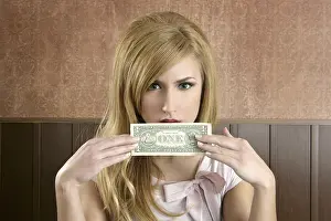 Dollar note retro woman holding hand hiding face vintage office