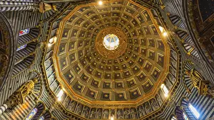 The dome of the cathedral with starry sky and black and white striped marble columns and round arches