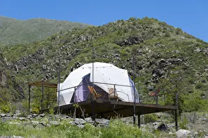 Framed Print : Dome tent on a wooden terrace in green mountain landscape under blue sky