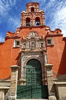 Category Cities DE Prints: Door of a colonial building with red facade and bell tower under a clear blue sky