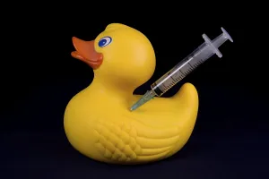 Doping duck with syringe