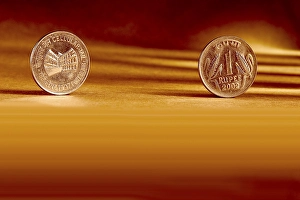 Double pair Indian currency one rupees coin front side and backside manner embossed Cellular Jail Port Blair 1997 on orange background