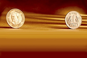 Double pair Indian currency one rupees coin front side and backside manner embossed Rajiv Gandhi 1944-1991 on orange background