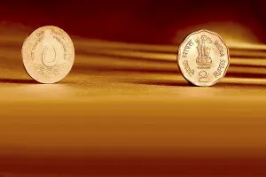 Double pair Indian currency two rupees coin front side and backside manner embossed water for life world food day 1994 on orange background