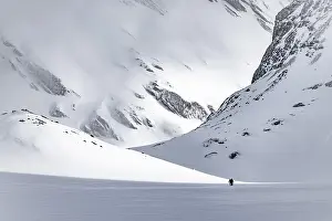 Dramatic atmosphere, Ski tourers in the vast landscape