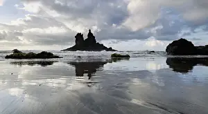 Dramatic clouds with rock formation on the beach of Playa de Benijo