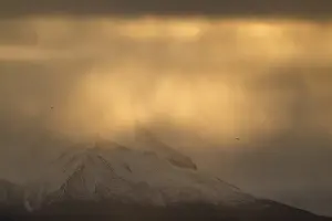 Dramatic light atmosphere, snowy mountains