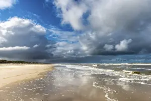 Dramatic rain clouds on the North Sea beach