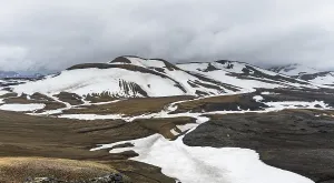 Dramatic volcanic landscape with mountains and snow
