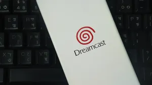 Dreamcast logo on a smartphone with a keyboard backdrop