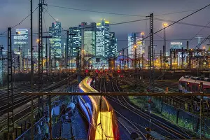Driving train in front of Frankfurt am Main central station in front of the skyline