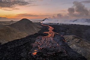 Drone image of a volcanic eruption in the evening light in Grindavik