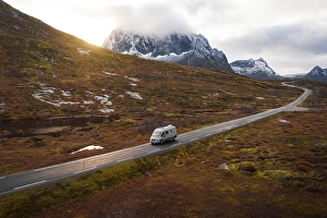 Category Scandinavia Prints: Drone shot, campervan on a road with autumnal vegetation
