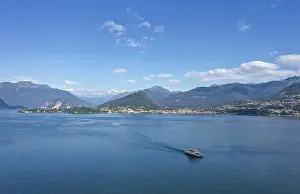Drone shot, drone photo of the ferry on Lake Maggiore with Alpine panorama