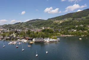 Drone shot, lake promenade with boats at Mondsee